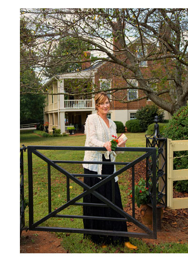 Laura Wood standing at a gate