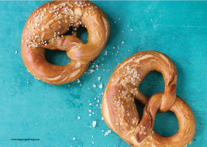 Two pretzels on a blue background.
